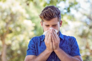 man suffering with allergies