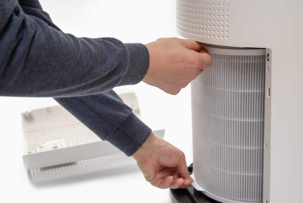 air purifier filter being changed