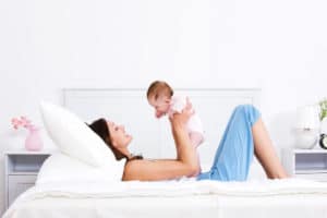 mother playing with baby